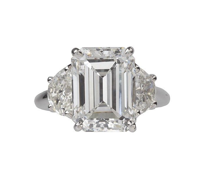 An emerald-cut diamond three-stone engagement ring