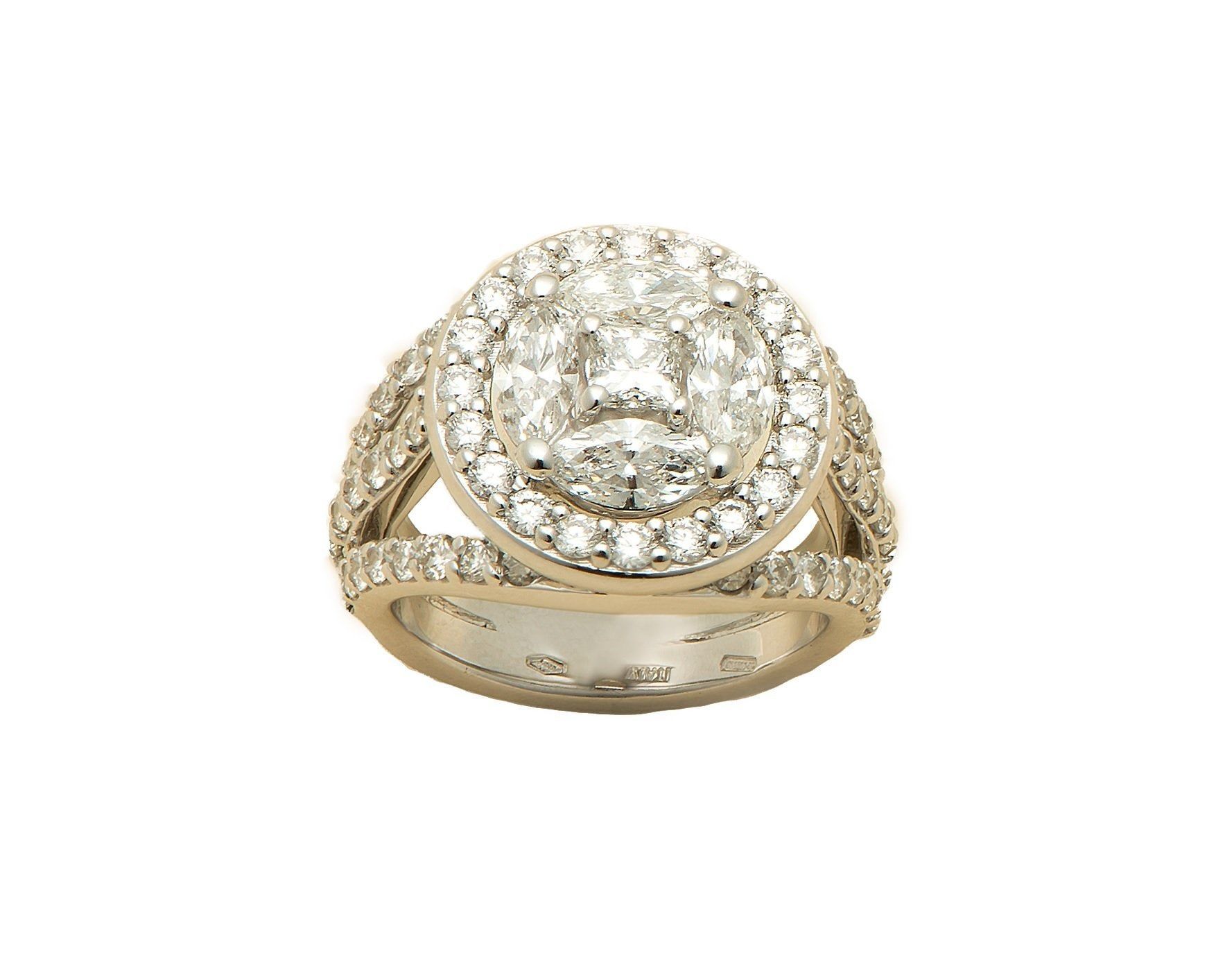 A cushion-cut diamond in a yellow gold halo setting
