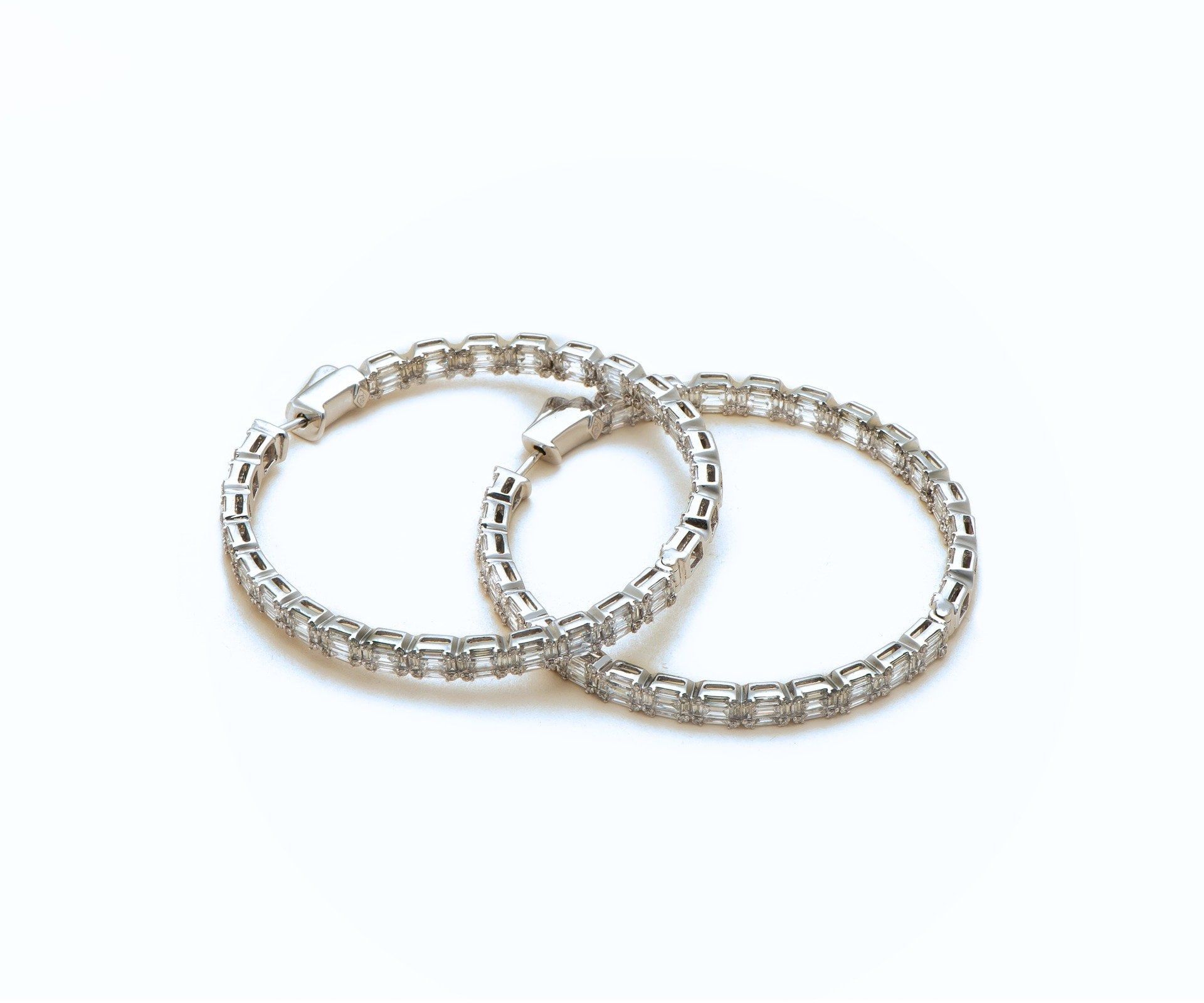 Three interlocking diamond-set circles as a drop earring