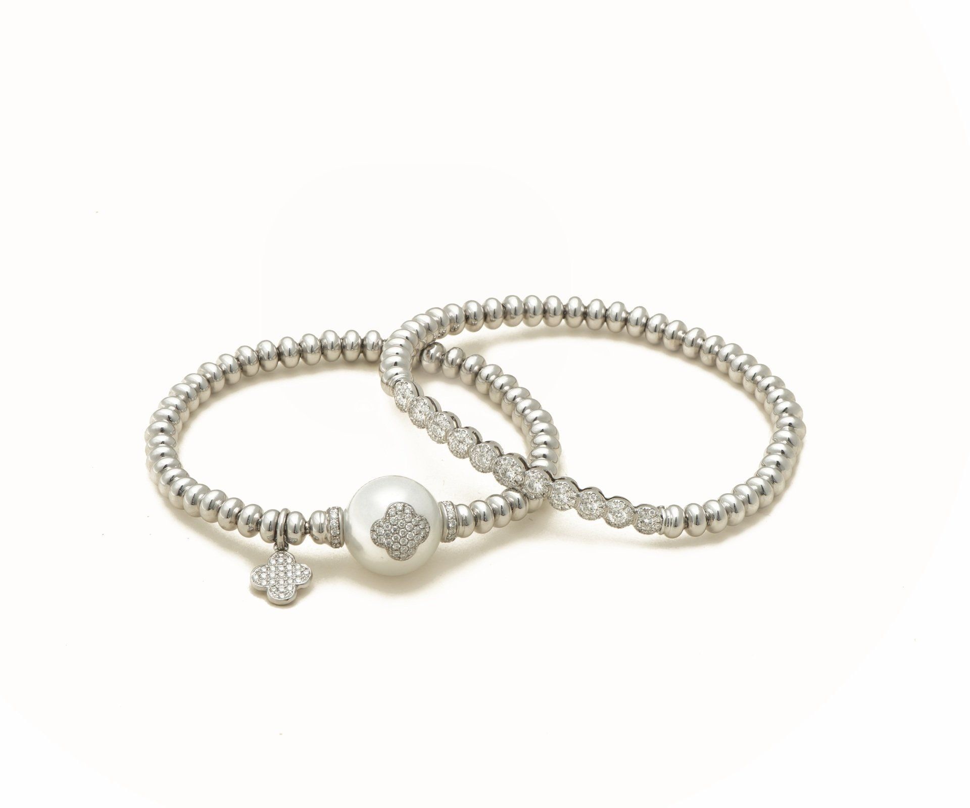 A pearl and pavé diamond bangle set
