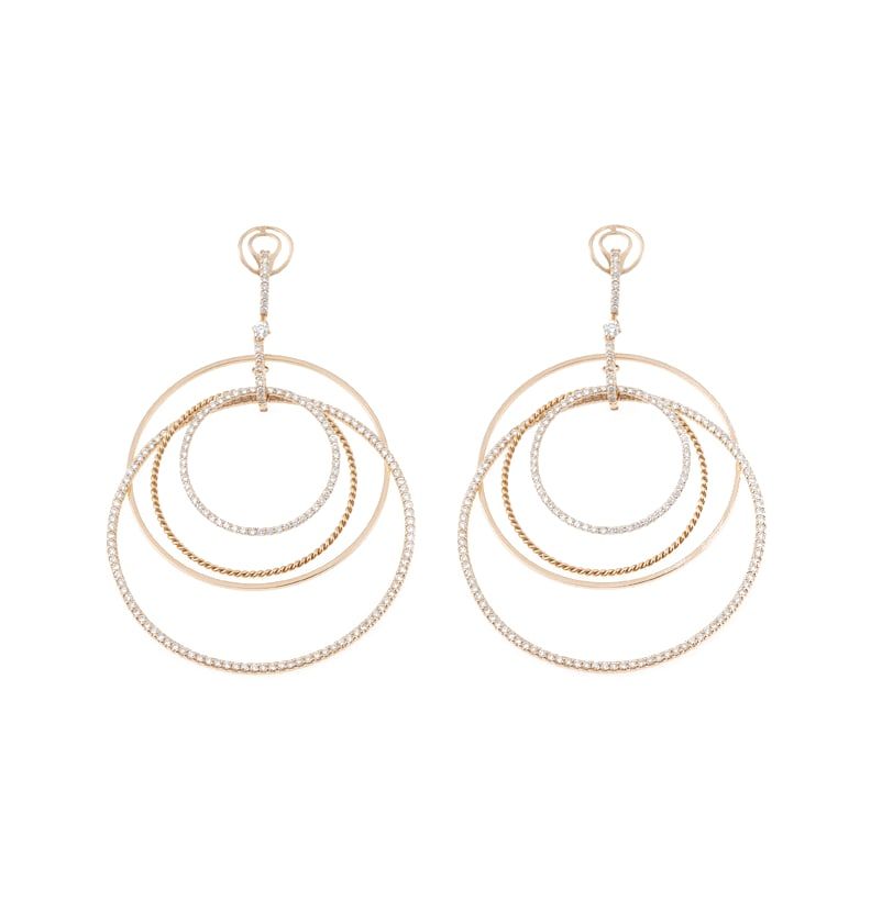 Three graduated rose gold circles as a drop earring