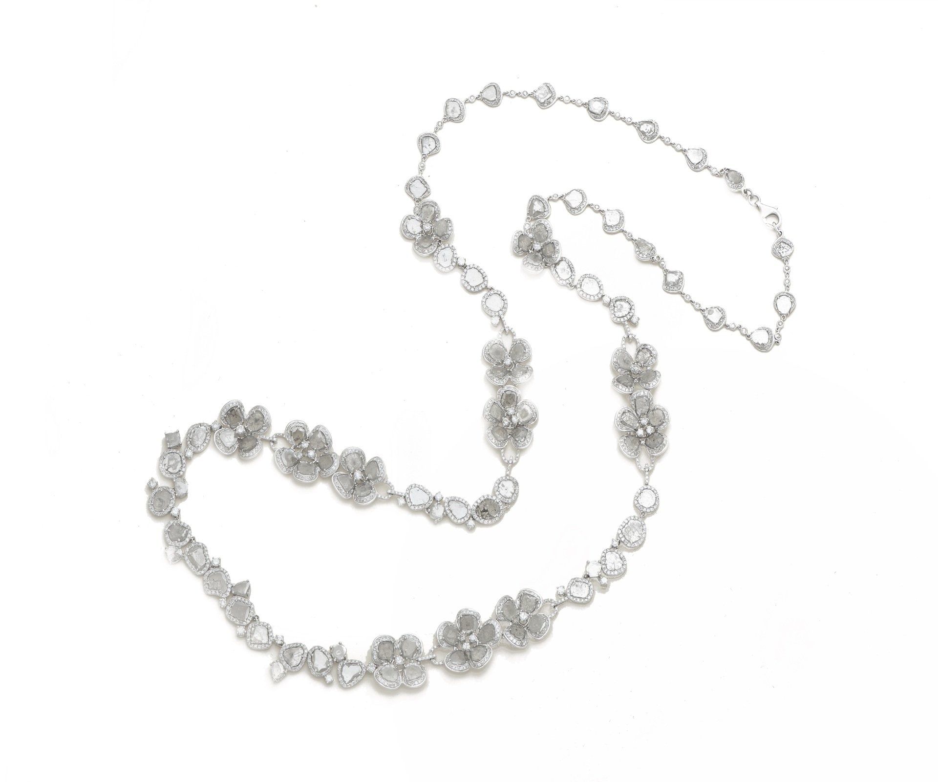 A long silver chain set with diamond flower stations
