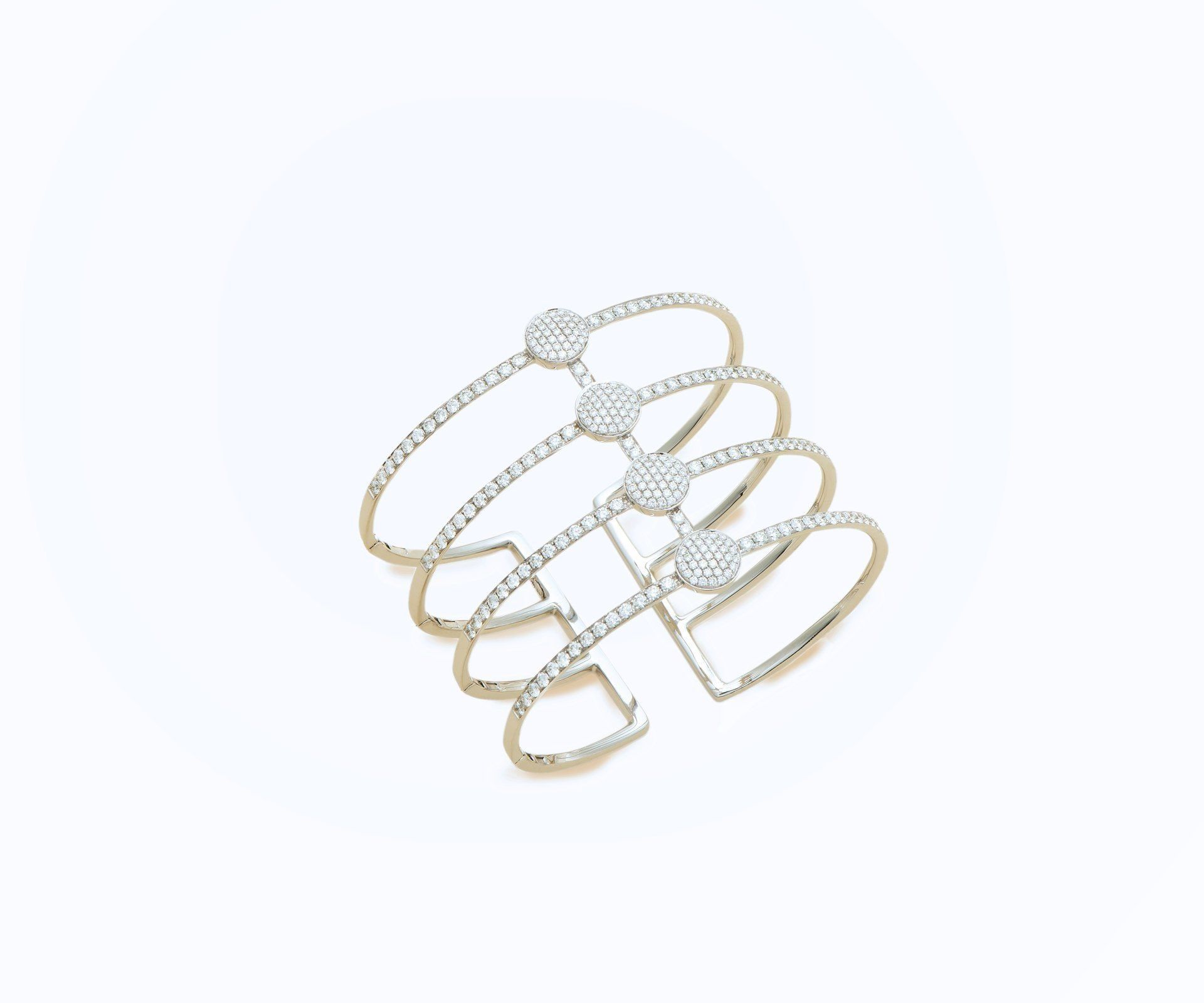 An openwork white gold wire cuff