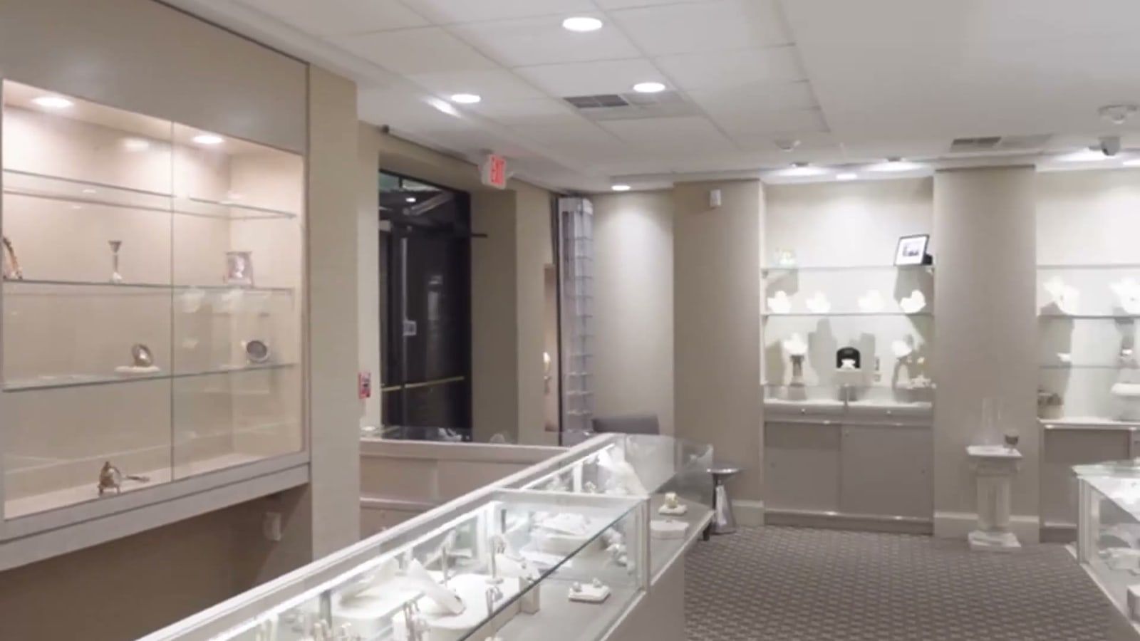The display cases inside Arlene &amp; Roberta Jewelry, lit and running the length of the room